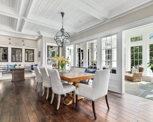 Informal bench dining and spacious area next to bright and cheery sunroom Informal bench dining and spacious area next to bright and cheery sunroom